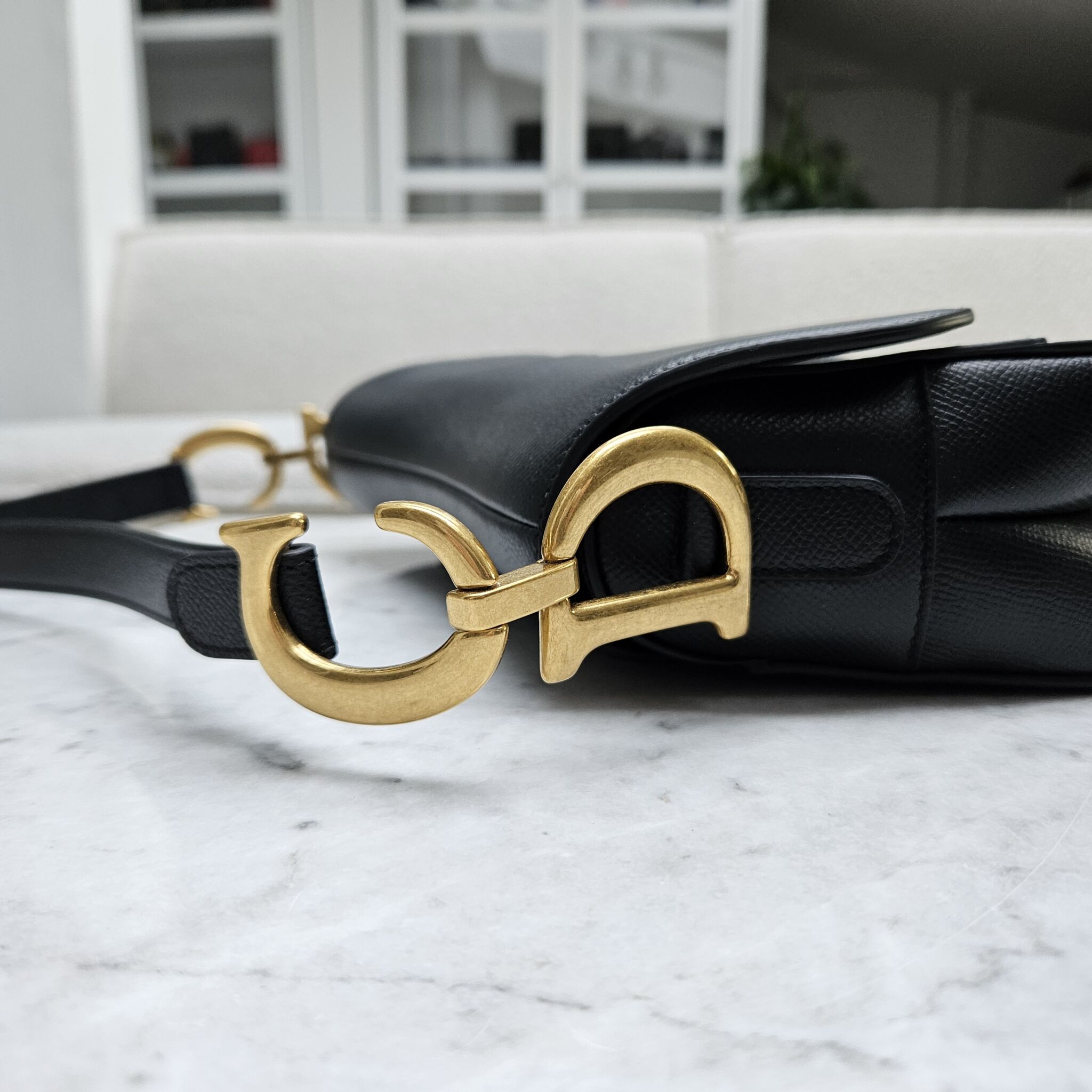 Dior saddle discount bag black gold