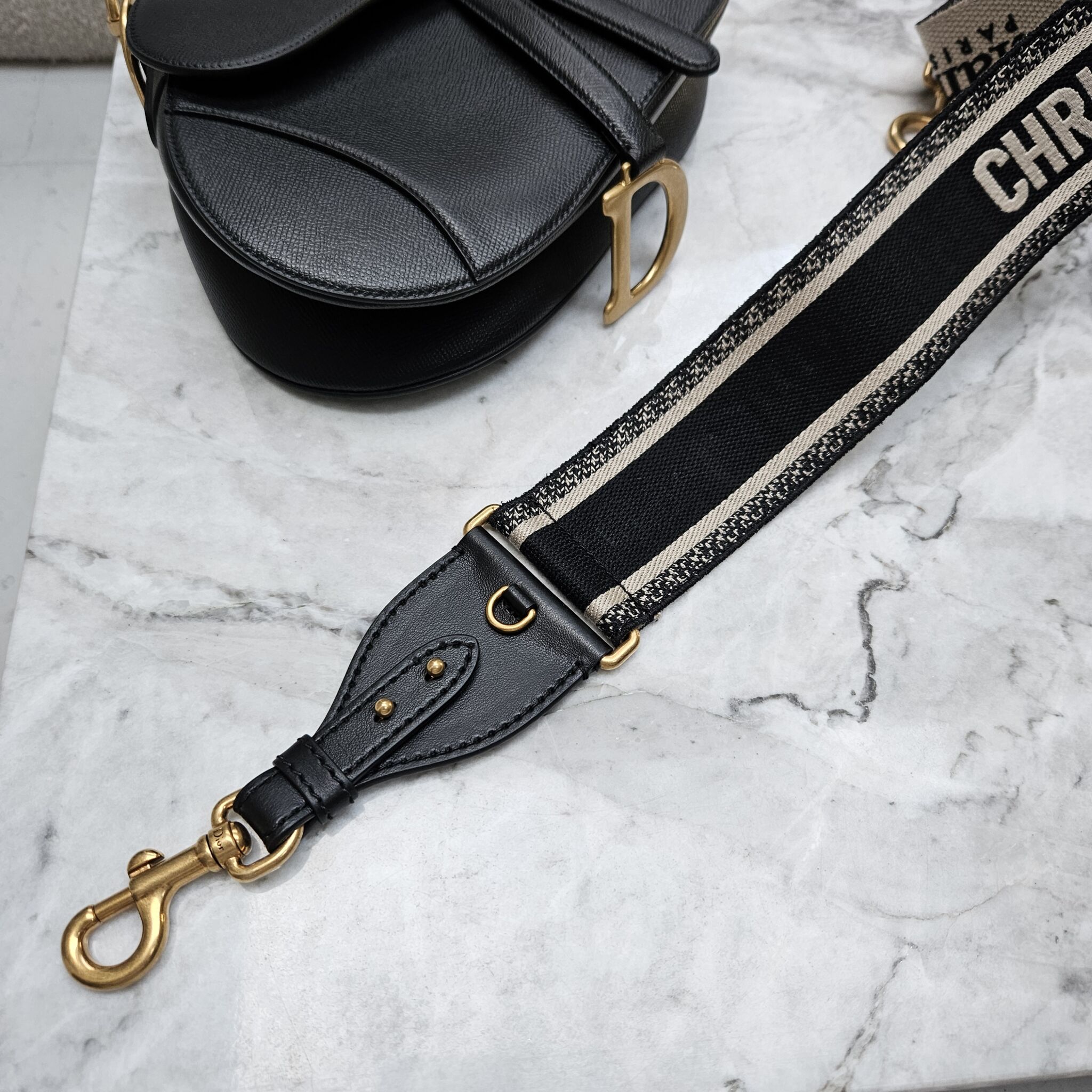 Dior saddle outlet bag strap price